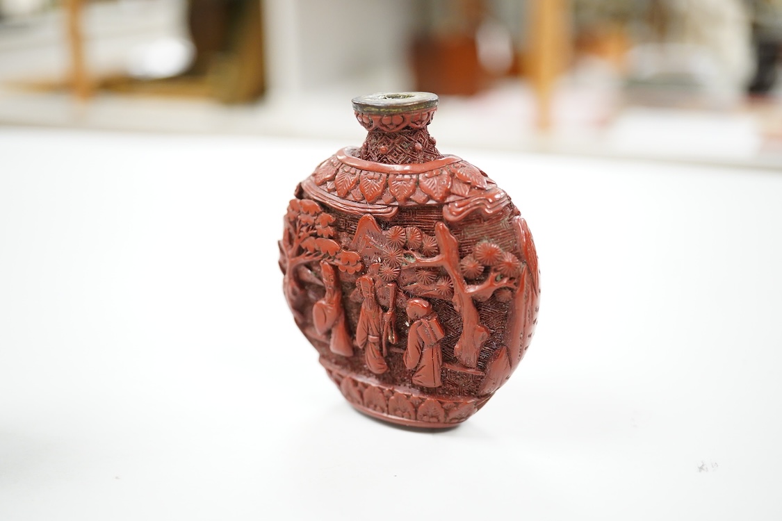 A Chinese cinnabar lacquer snuff bottle, a glass overlay snuff bottle and an underglaze copper red snuff bottle-9cm high (3)